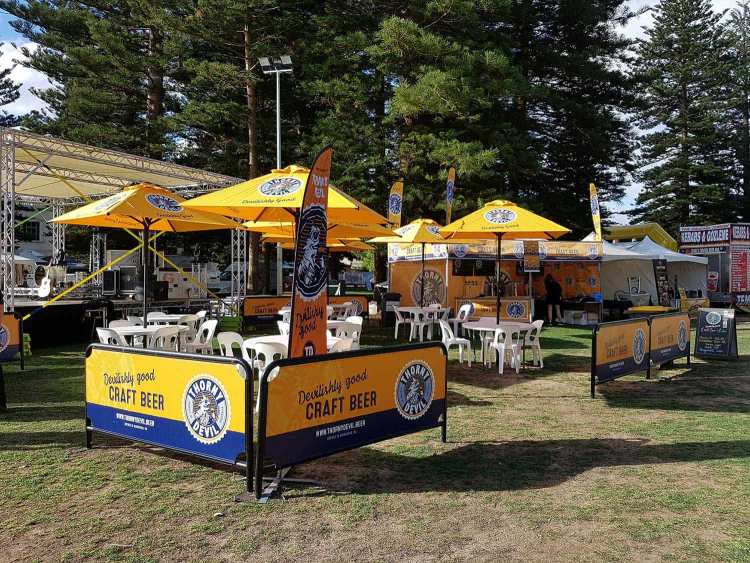 Branded umbrellas at cafe setup